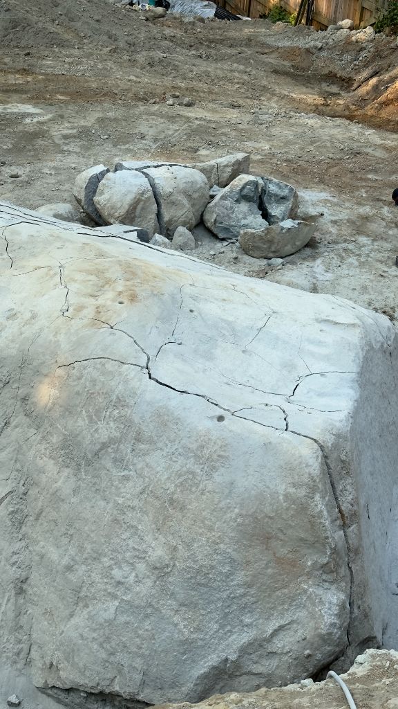 Cracked and split foundation rock — residential excavation